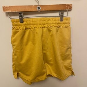 Yellow athletic shorts with adjustable + elastic waistband